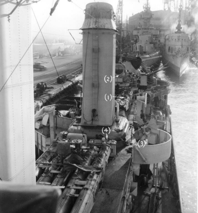 Looking aft from Madison’s foc’sle, New York Navy Yard, 1 January 1944, showing a sentry conversing with a shipmate alongside Mt. 51. Although taken looking into the glare of the sun, the view shows the various electronic gear on the foremast and the radar fitted atop the Mk.37 director. (U.S. Navy Bureau of Ships Photograph BS 59094, National Archives and Records Administration, Still Pictures Branch, College Park, Md.)