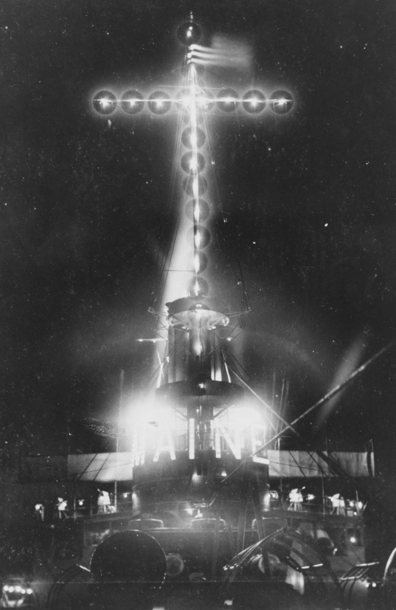 The ship is illuminated for public display during a visit to Watch Hill, R.I., 25–28 August 1905. (Naval History and Heritage Command Photograph NH 102423)