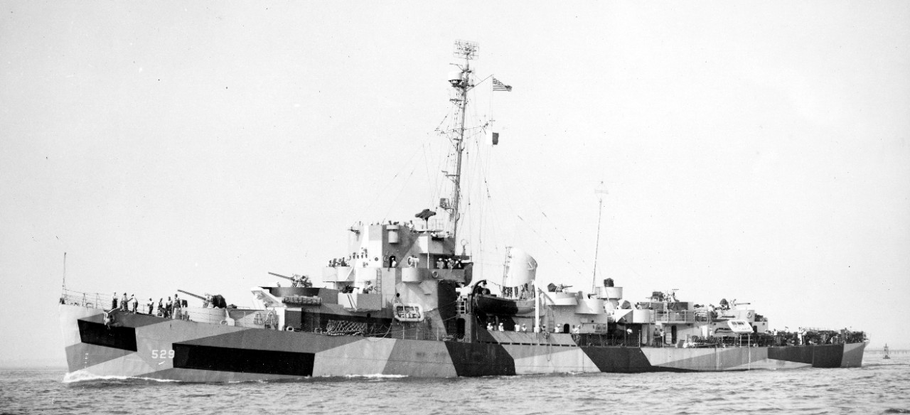 Port broadside view of Mason, having been completely repainted in another disruptive camouflage pattern, underway at Boston, 15 August 1944. (U.S. Navy Photograph 80-G-382851, National Archives and Records Administration, Still Pictures Division, College Park, Md.)