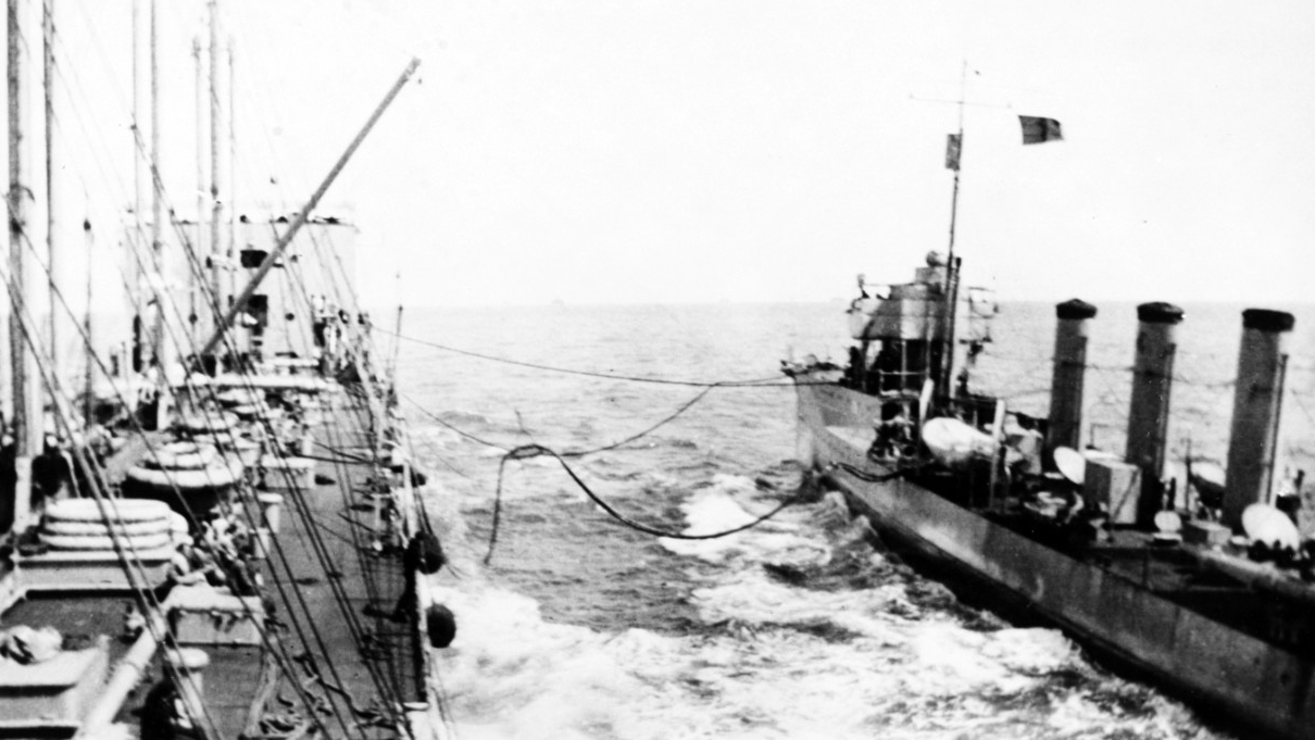 Maumee replenishes McCall’s fuel bunkers, 22 September 1917. Note the red “Baker” refueling flag flying from the destroyer. (Naval History and Heritage Command Photograph NH 93098)