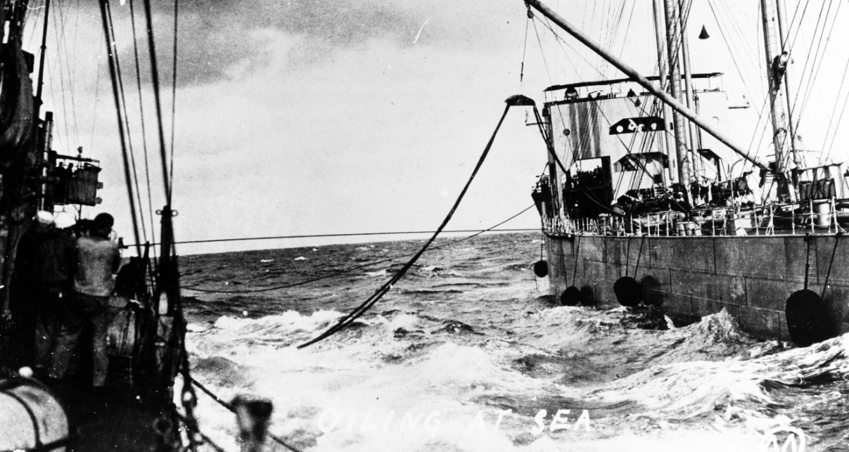 Warrington (Destroyer No. 30) oiling at sea during World War I, from either Kanawha (Fuel Ship No. 13) or Maumee. (Courtesy of Gustavus C. Robbins, Somerville, Mass., 1973, Naval History and Heritage Command Photograph NH 77154)