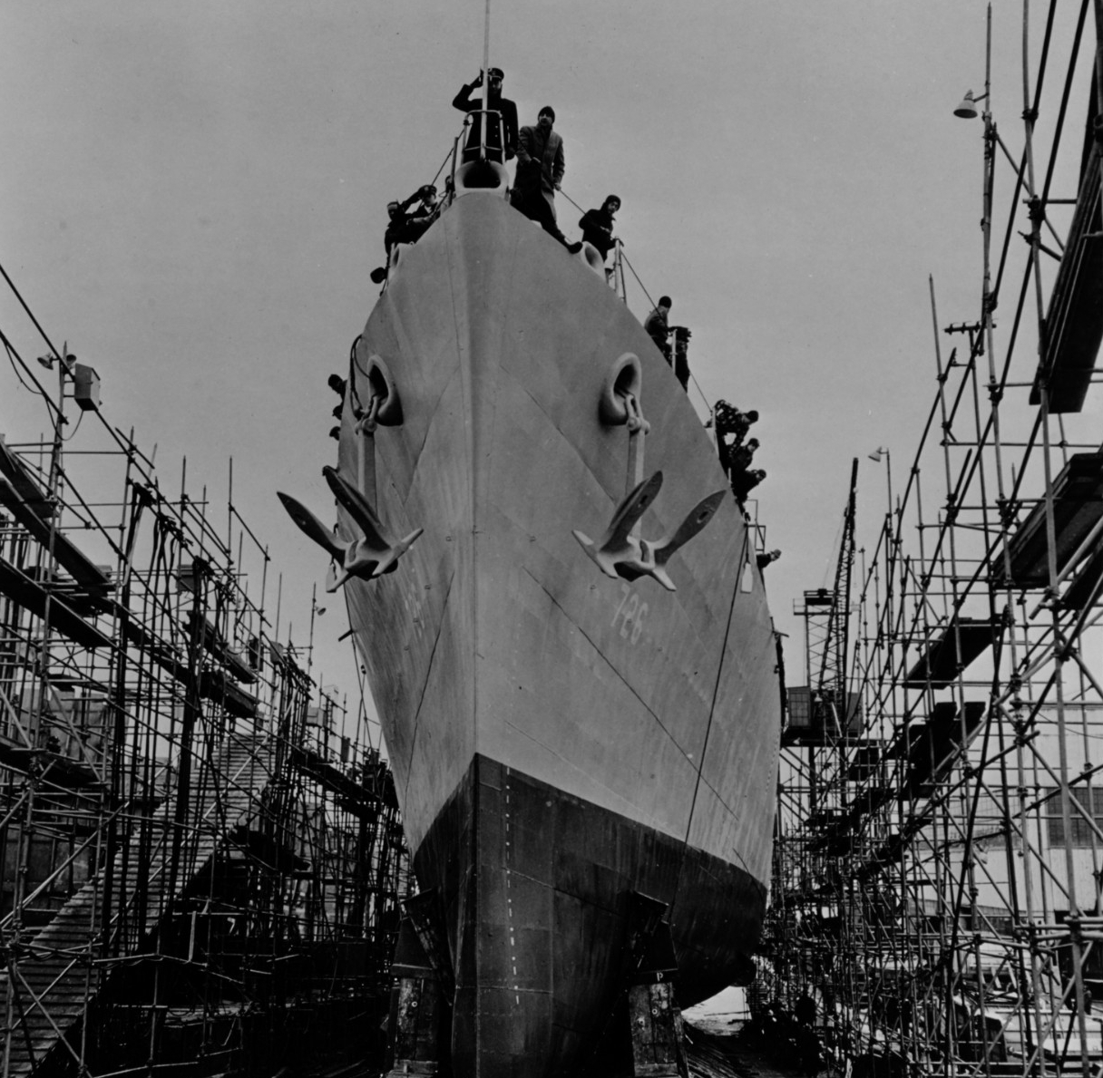 Men ride the ship down the ways, some of them looking on apprehensively, as Meredith is launched at Bath Iron Works, four days before Christmas of 1943. (Naval History and Heritage Command Photograph NH 84817)