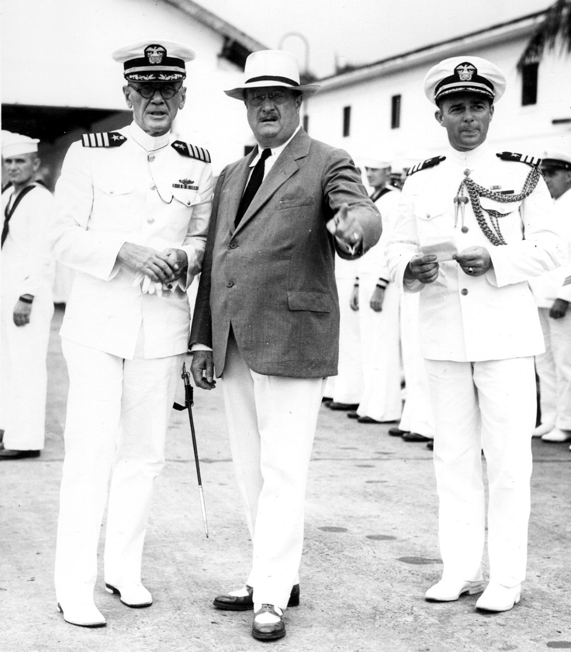 Cmdr. Merrill (R), his aiguillettes indicating his aide status, accompanies Assistant Secretary of the Navy Roosevelt (C) as he inspects the Fleet Air Base, Coco Solo, Canal Zone, on 4 August 1933. Capt. Paul P. Blackburn stands at left. (U.S. Na...