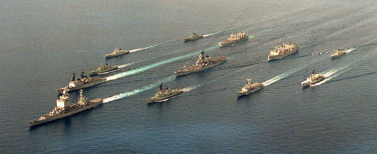 Merrill with the first battleship battle group to deploy to the western Pacific since the Korean War underway with Australian ships during a training exercise in the South China Sea, 7 January 1986. (Clockwise L-R) Long Beach, Merrill, HMAS Swan ...