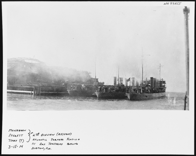 Destroyers coaling at Dry Tortugas, Fla., 15 March 1914.  Members of the Second Division, U.S. Atlantic Fleet Torpedo Flotilla, these ships are (from left to right): Monaghan (Destroyer No. 32); Sterett (Destroyer No. 27); and (perhaps) Terry (Destroyer No.25). This photo is one of a series from the collection of Walke (Destroyer No.34) crewmember, which was another member of the division. Courtesy of Jim Kazalis, 1981. (Naval History and Heritage Command, NH 99855)