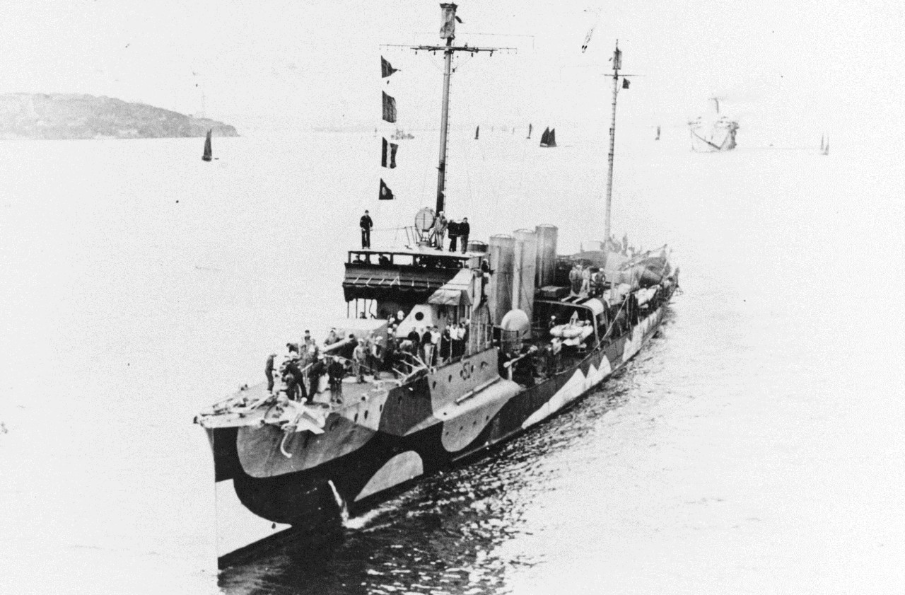 Photographed from the troop transport Pocahontas (Id. No. 3044), O’Brien stands in to port during 1918. Note the dazzle camouflage worn by the destroyer, with her identification number painted on her hull beneath the bridge, and by the transport following her. (Naval History and Heritage Command Photograph NH 82973) 