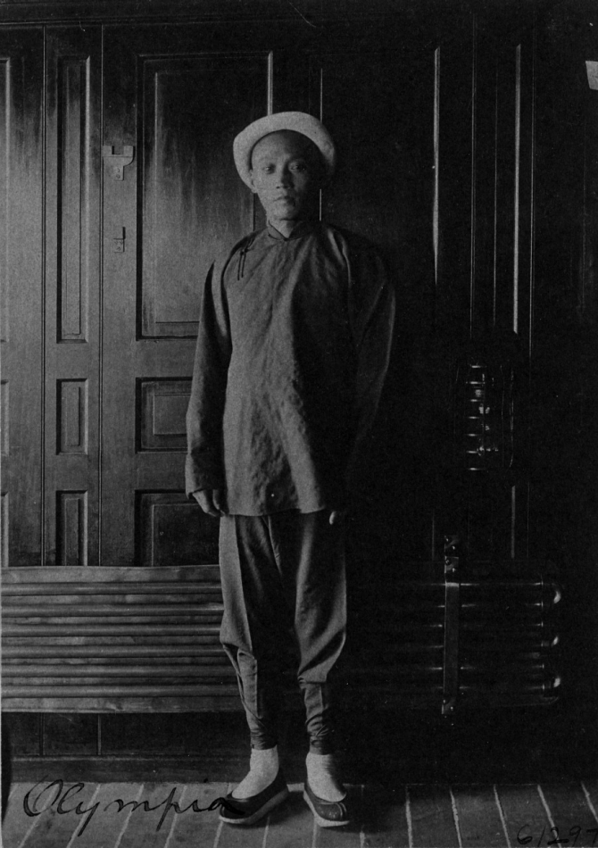 A Chinese steward on board the ship wears traditional dress, c. 1898. (George Grantham, Cyanotype print, U.S. Navy Photograph NH 43215, Photographic Section, Naval History and Heritage Command)