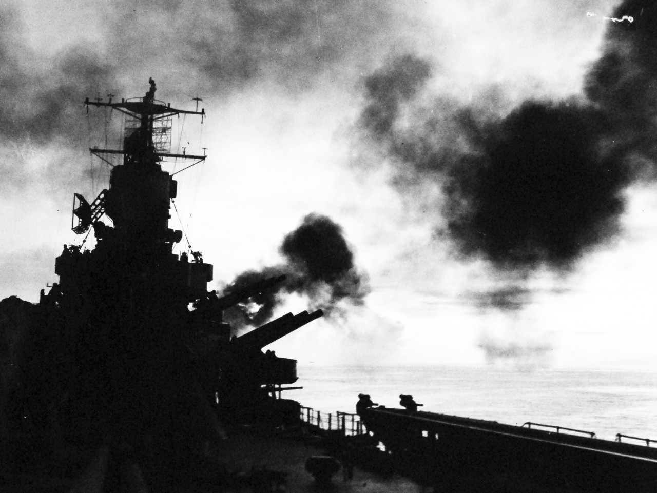 80-G-57445: Battle of Cape Gloucester, New Britain, December 1943-January 1944. Bombardment of Cape Gloucester, New Britain, by USS Phoenix (CL-46) and other ships of the Task Force. Taken by USS Nashville (CL-43), December 24-26 1943. 