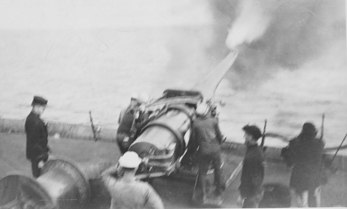 Ship's forward starboard six-inch gun firing in target practice, during World War I. The officer at left is Lt. (later Adm.) Jesse B. Oldendorf. Courtesy of the Naval Historical Foundation- President Lincoln Collection. (Naval History and Heritage Command Photograph NH 103357)