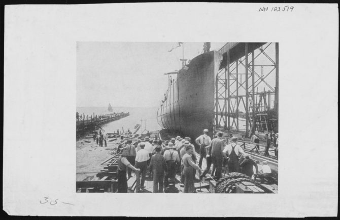 Roe sliding down the ways during her launching, 24 July 1909. (The original print is a halftone reproduction. Collection of the Society of Sponsors of the United States Navy; Naval History and Heritage Command Photograph NH 103519)  