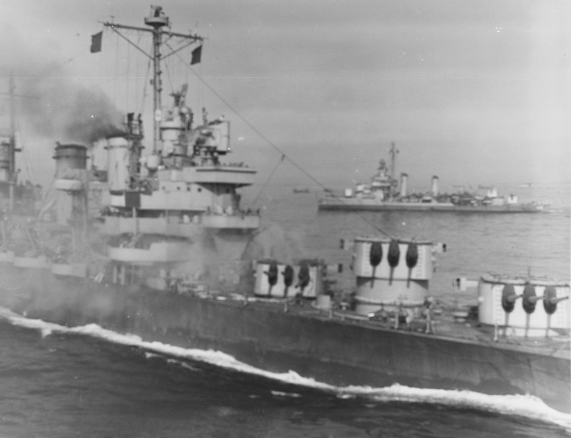 A starboard close-up view of Savannah shortly thereafter emphasizes the tremendous destructive force of the bomb as the ship begins to settle by the bow. Note that the port 6-inch gun in Turret III is depressed toward the deck. (U.S. Army Signal Corps Photograph SC 364342, National Archives and Records Administration, Still Pictures Division, College Park, Md.)