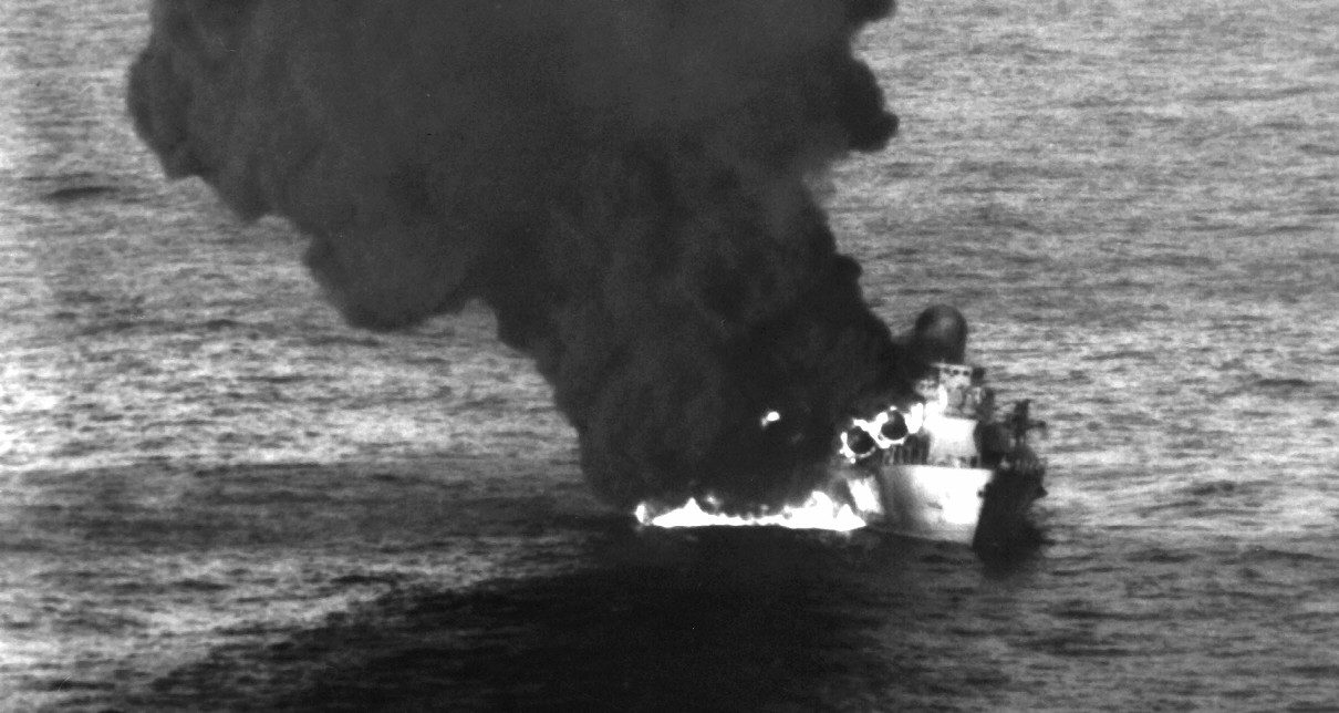A Libyan Nanuchka II class missile corvette ablaze after being hit by Harpoons launched by aircraft from VA-85, 24 March 1986. (U.S. Navy Photograph 330-CFD-DN-SN-86-05289, National Archives and Records Administration, Still Pictures Division, Co...