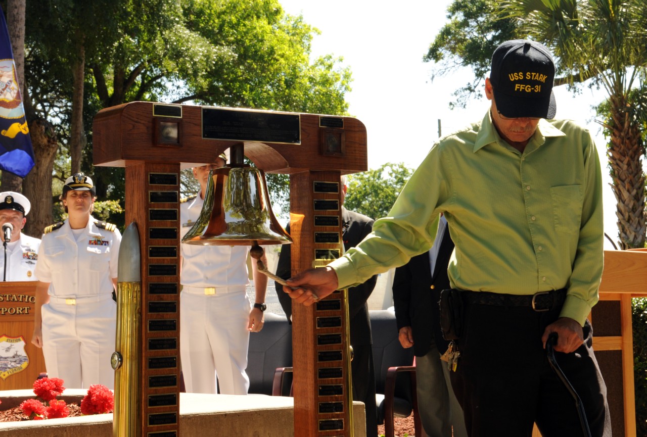 Clifford Cellars, a former Stark crewman, rings one bell for each of his 37 fallen shipmates from the Iraqi attack on 17 May 1987, during a remembrance ceremony at NS Mayport, Fla., 16 May 2014. (Mass Communication Specialist 2nd Class Damian Berg, U.S. Navy Photograph 140516-N-TC587-054, Navy NewsStand)
