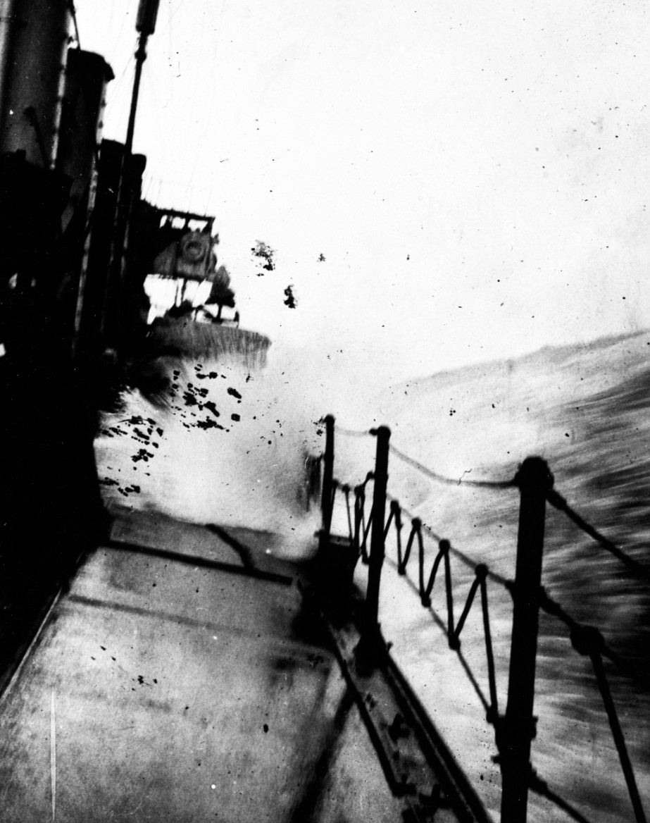 Sterett in rough seas off Ireland's coast, 1918. This view looks forward along her starboard side, as a wave breaks over her deck amidships. Collection of Lt. Cmdr. Leonard Doughty, 1929. (Naval History and Heritage Command Photograph, NH 1868)