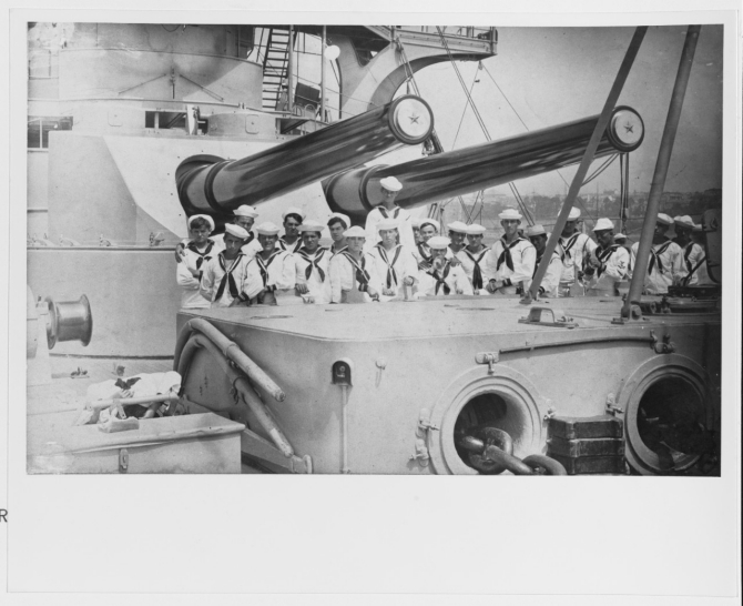 Men of the armored cruiser’s First Division pose under her forward guns, circa 1907–1908. Note the forecastle winch housing in the foreground. (U.S. Navy Photograph NH 94013, Collection of Harry Gilfillan, Photographic Section, Naval History and Heritage Command)