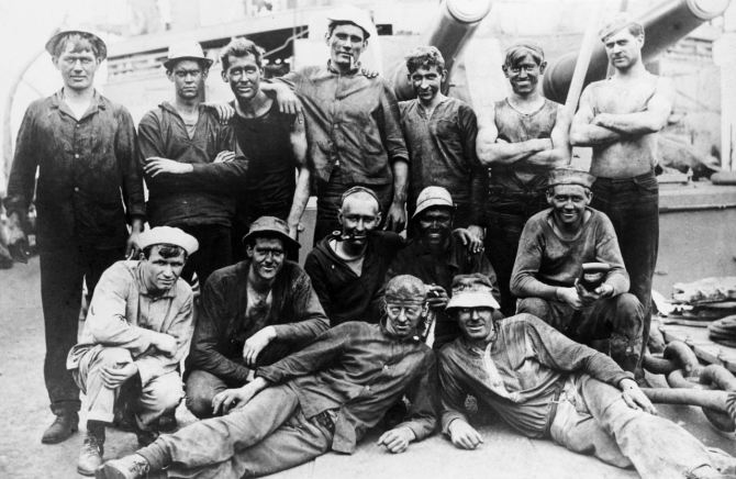 Some of her firemen, their blackened appearance indicating they most likely have just completed coaling ship, circa 1909–1910. (U.S. Navy Photograph NH 94006, Collection of Harry Gilfillan, Photographic Section, Naval History and Heritage Command)