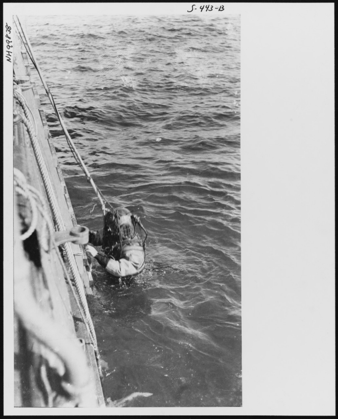 Chief Gunner's Mate Stephen J. Drellishak ascending unassisted from a ten-foot stage at the end of his record 274 foot dive from Walke to the sea floor on 3 November 1914. His ascent from the bottom occupied 1 hour and 20 minutes. This dive was one of a series of deep diving tests conducted in Long Island Sound in late October and early November 1914. (U.S. Naval History and Heritage Command Photograph NH 99838, courtesy of Jim Kazalis, 1981)