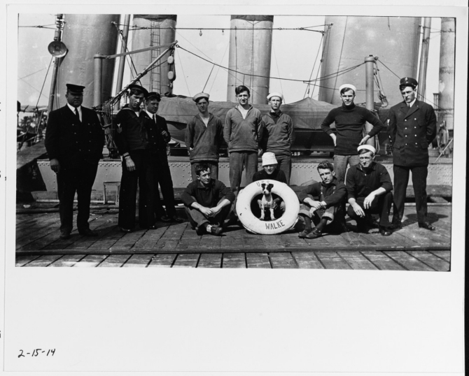 Crew members and their mascot pose on a dock alongside Walke on 15 February 1914. Note life ring with ship’s name, variety of uniforms, and the portly chief petty officer at left. (U.S. Naval History and Heritage Command Photograph NH 92534, courtesy of Jim Kazalis, 1981)