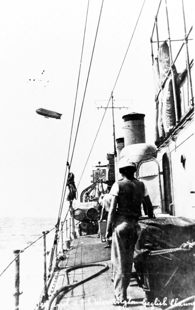 Deck view, taken while on patrol in the English Channel, 22 July 1917, with a French blimp overhead. Courtesy of Mr. Gustavus C. Robbins, Somerville, Mass., 1973. (Naval History and Heritage Command Photograph NH 77166).