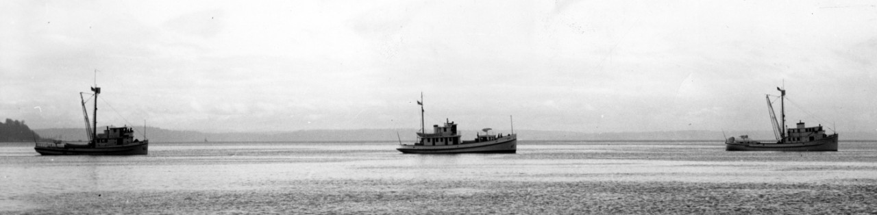 YP-72 (R) leads YP-73 and YP-74, circa December 1940. Note the different silhouettes that reflect the diversity of the civilian craft acquired for employment as district patrol vessels (YP). All ships appear to be painted in No.5 Navy Gray, and h...