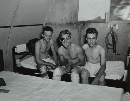 (L to R) Michael N. Kuryla, Jr., Cox. USNR; Robert M. McGwiggam, S1c USNR; and John H. Armistead, S2c, USNR, survivors of the USS Indianapolis in Naval Base Hospital No. 20, Peleliu, 5 August 1945., 