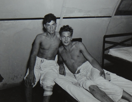 (L to R) John Matrulla, S1c USNR and Roger Spencer, S1c USNR, survivors of the USS Indianapolis in Naval Base Hospital No. 20, Peleliu, 5 August 1945.