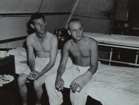 (L to R) Willie Hatfield, S2/c USNR and Cozell Smith Cox. USNR (shark bite on left hand), survivors of the USS Indianapolis in Naval Base Hospital No. 20, Peleliu, 5 August 1945.