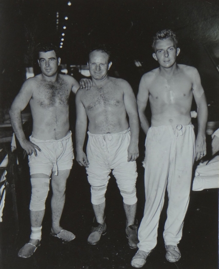 (L to R) Huie B. Phillips, S2c USNR; John Olijar, S1c USNR; and Glen L. Milbrodt, S2c USNR, survivors of the USS Indianapolis in Naval Base Hospital No. 20, Peleliu, 5 August 1945.