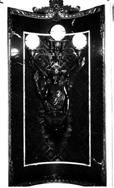 Figure 39: Liberty Lamp, Indian Treaty Room. Crowned by a tiara modeled after that of Bartholdi's Statue of Liberty, this classically garbed figure carries the torch of liberty and the chain of slavery with one link broken.