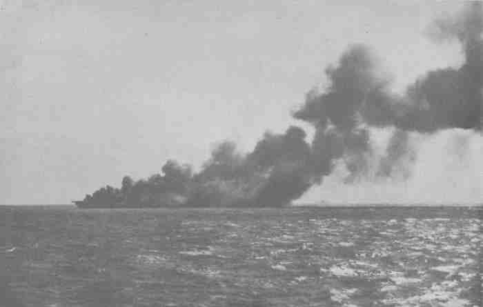 Ticonderoga (CV-14) burning off Formosa at 1212 on 21 January after suicide attack on Task Group 38.3