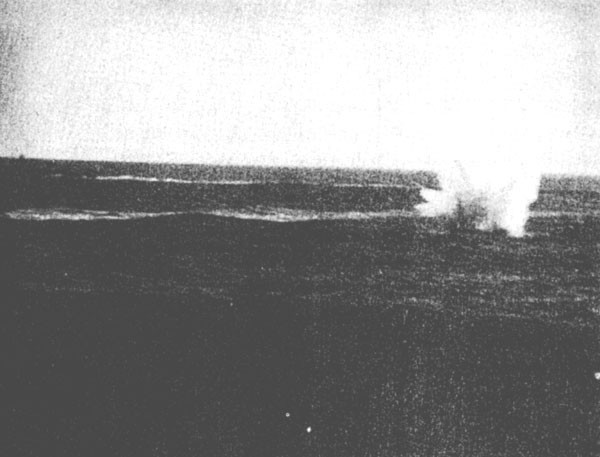 Japanese dive bomber crashes off starboard bow of Enterprise
