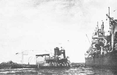 Image of YTM Harbor Tug, Medium (With freight barge alongside). 