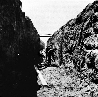 90th Seabees excavating for Tank-farm Pipeline, Iwo Jima. 
