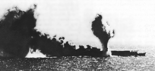 JAPANESE CARRIER SHOHO, dead in the water and smoking from repeated bomb and torpedo hits, was sunk by carrier planes in the Coral Sea Battle. (USN 17026) 