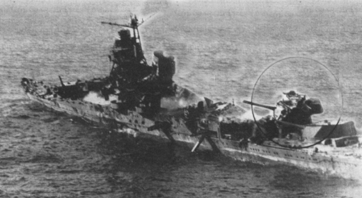 JAPANESE CRUISER MIKUMA, sunk at the Battle of Midway, lies battered and smoking from the attacks of pilots of MAG-22 and the American carriers. (USN 11528) 