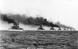 Image of U.S. Atlantic Fleet Battleships, steaming out of Hampton Roads, VA. , in December 1907, to begin their cruise around the World. Leading two ships are: Kansas (BB-21) and Vermont (BB-22). NH 92091