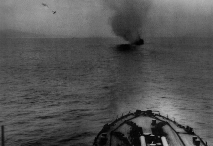 A Japanese "Val" makes a suicide run on Idaho at Okinawa on 7 April 1945 