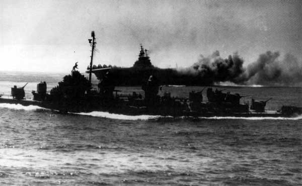 Intrepid (CV 11) burns after a kamikaze hit off Okinawa on 16 April 1945