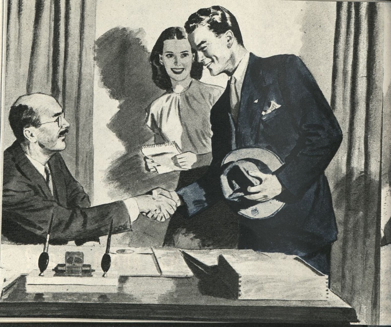 A man standing and shaking the hand of another man who is seated - a woman with a pad looks on