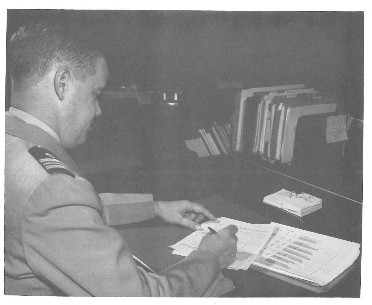 Man signing and reviewing documents