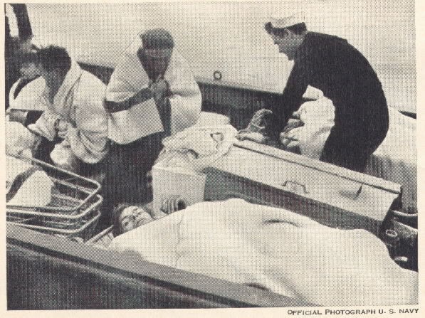 Figure 2.--Rescued survivors of shipwreck. Note the physical condition of the patients. Stokes stretcher and blankets are shown in use.