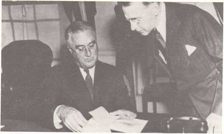 Captain Knox presents President Roosevelt with copy of final volume of Naval Documents Related to the Quasi-War Between the United States and France.