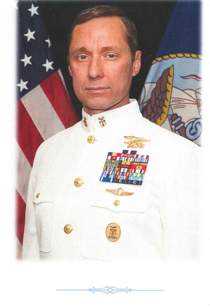 Jpeg of page 4 from the commemorative booklet:' In Honor of Master Chief Britt K Slabinski, United States Navy, Retired: MEDAL OF HONOR - HALL OF HEROES INDUCTION CEREMONY - THE PENTAGON AUDITORIUM- 25 MAY 2018'  It shows a photograph of Master Chief Brit K. Slabinski, United States Navy, Retired. 