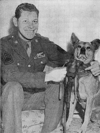 Image: T-Sgt. Harold E. Rogers, Seneca, with his flying mascot Mister. 