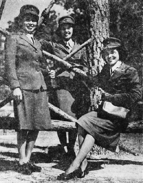 Image: Three Indian girls in the Women's Reserve of the U.S. Marine Corps: Left to right, Minnie Spotted Wolf,, Montana; Celia Mix, Potawatomi, Michigan; and Viola Eastman, Chippewa-Sioux, Minnesota. Official U.S. Marine Corps photograph. 