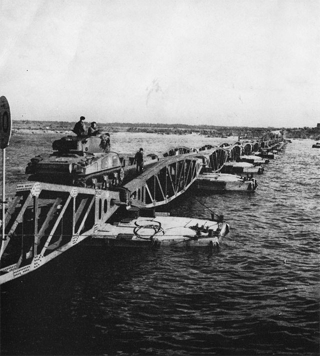 The floating roadway is completed, and a tank starts across.