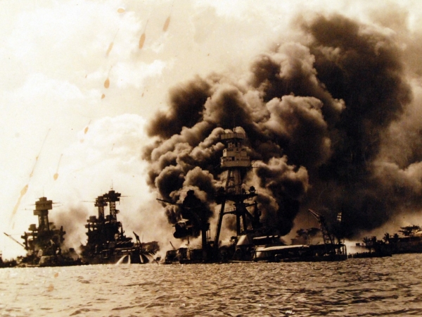 80-G-32424:  Pearl Harbor Attack, 7 December 1941.  View looking up "Battleship Row" on 7 December 1941, after the Japanese attack. USS Arizona (BB-39) is in the center, burning furiously. To the left of her are USS Tennessee (BB-43) and the sunken USS West Virginia (BB-48).  Similar to NH 97378.  The spots on this print give a dramatic touch.  Official U.S. Navy photograph, now in the collections of the National Archives.      (9/15/15).