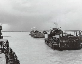 Column of US Navy Armored Troop Carriers (ATC) after departing USS Benewah (APB-35), on a patrol in the Mekong Delta.