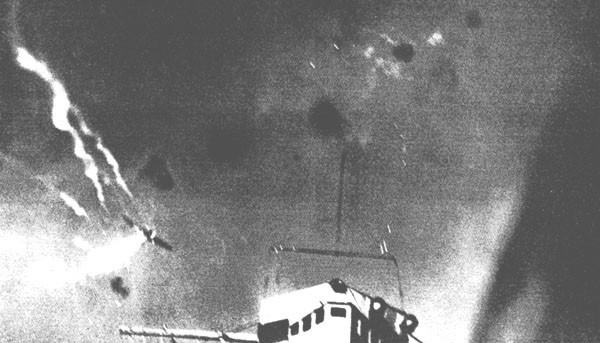 Image of The battle above the Enterprise; enemy dive bomber exploding in mid-air.