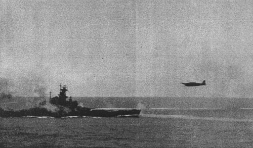 Torpedo plane under fire by South Dakota.'